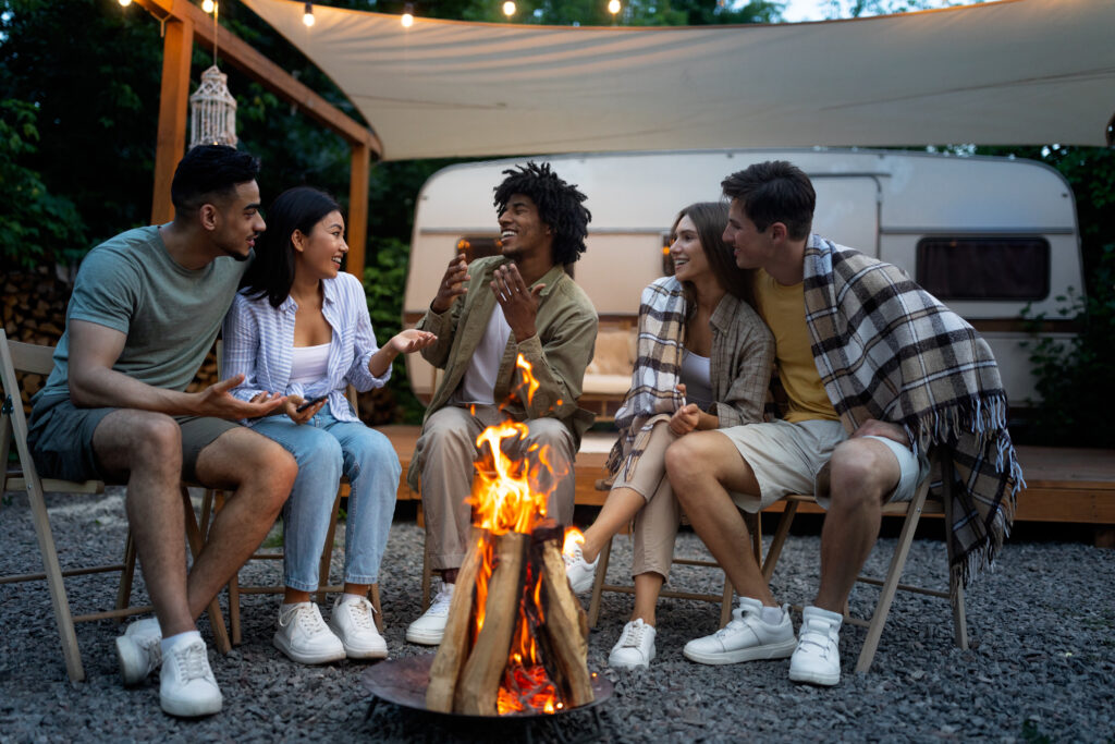 group of friends around a campfire