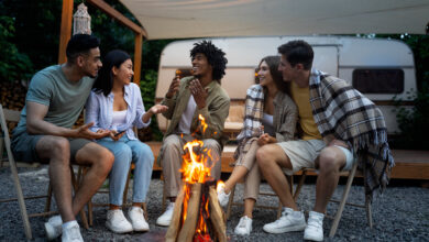 group of friends around a campfire