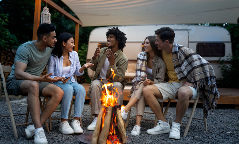 group of friends around a campfire