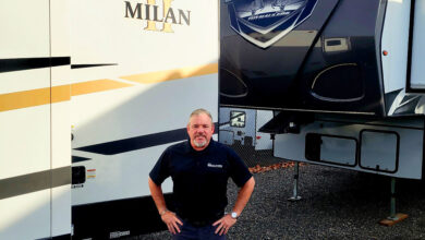 Eclipse RV Director of Sales Dewey Ulbright standing in front of Eclipse Milan