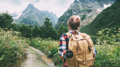 Woman hiking, camper, camping - Adobe Stock
