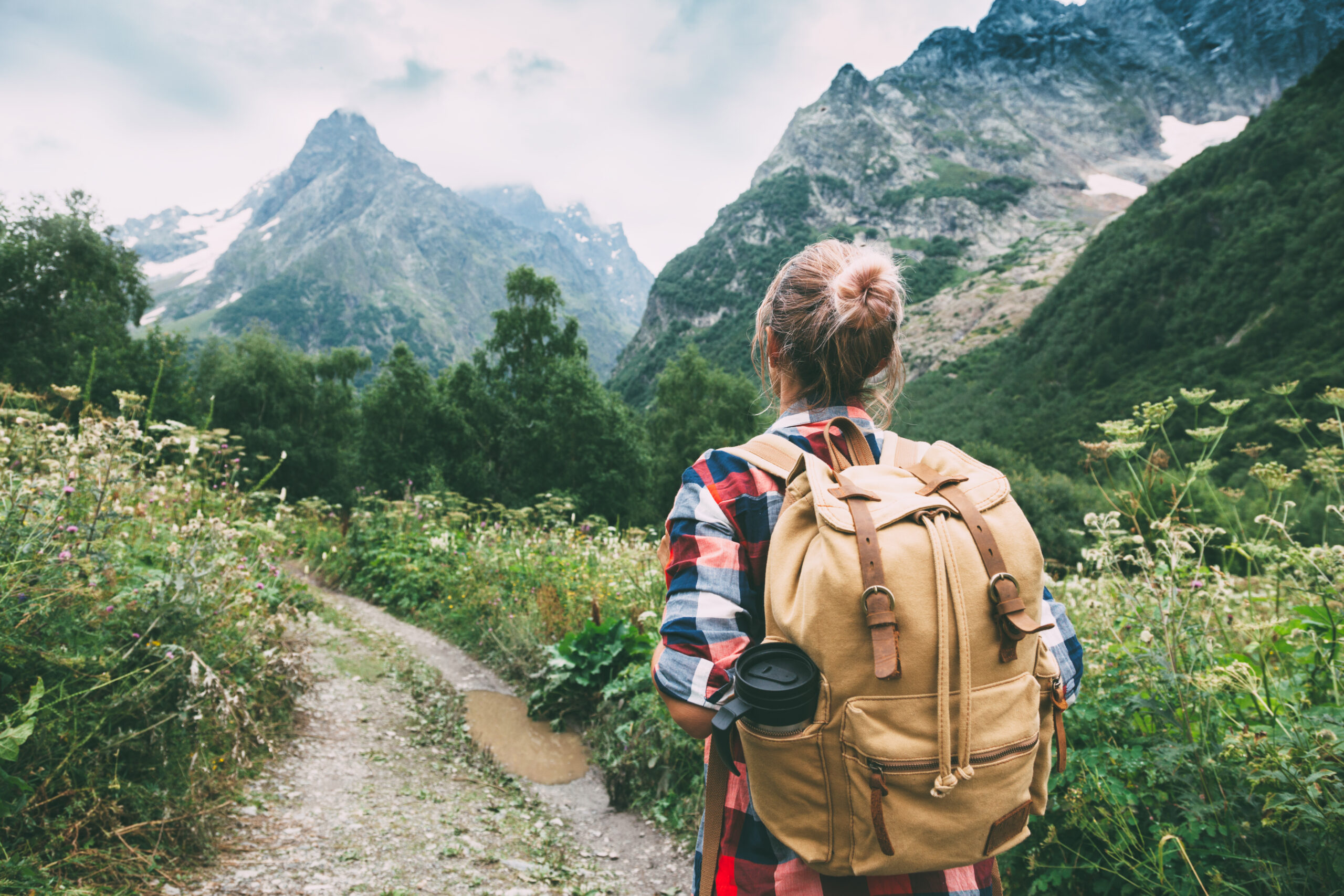 Woman hiking, camper, camping - Adobe Stock