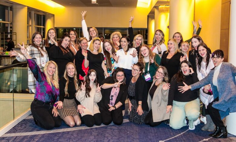 A large group of women posing during an RV Women's Alliance event.