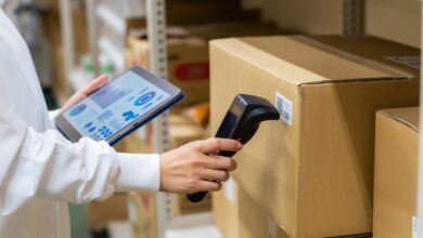 A person scanning a box to demonstrate keeping an accurate inventory count.