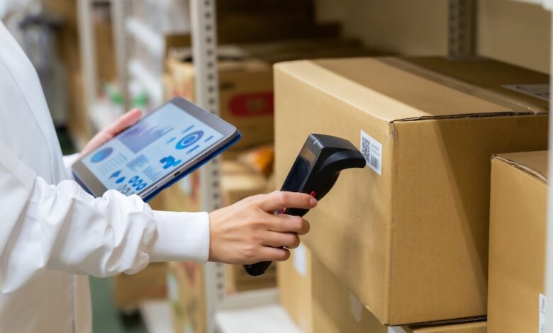 How To Achieve an Accurate Inventory Count Without a Yearly Count 2 A person scanning a box to demonstrate keeping an accurate inventory count.