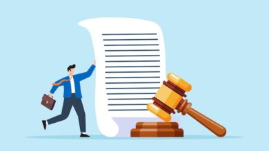 An illustration of a lawyer holding a legal document with a gavel next to it.