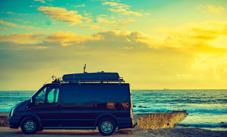 The Hidden Problems With RV Solar Power & How To Avoid Them 2 Camper van RV at sunrise on a coastline, demonstrating solar power needs for RVers