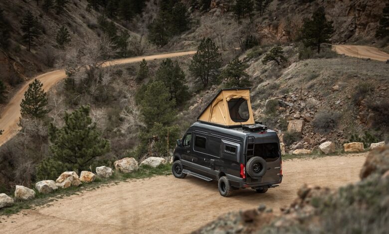 Off-Grid Ready: Rossmönster’s Next-Gen Overland Rigs 2 A photo of Rossmönster's Class B Skye van overlooking a forest and dirt road.