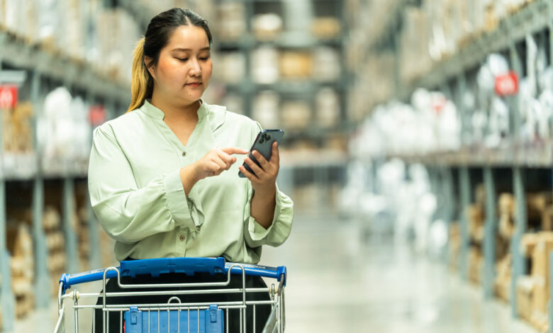 See Your RV Dealership Through Your Customers’ Eyes 2 A woman in an aisle of a store pushing a cart down an aisle, illustrating people seeing their store from a shopper's point of view.