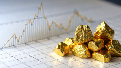 Turning Data Into Action: Essential DMS Reports for Dealers 1 Gold nuggets against an economic forecast graph to demonstrate DMS reports being a gold mine of data.