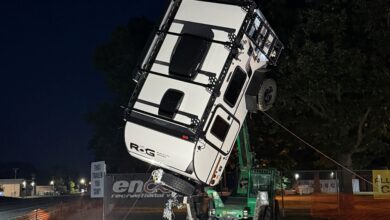 Encore RV hanging from crane