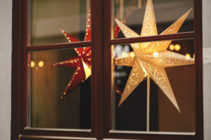 Decorative Christmas stars in a shop window to illustrate merchandising for RV winterization products.