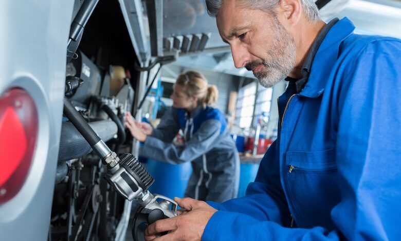 RV mechanics at work, illustrating the need to recruit and retain people in the RV industry.