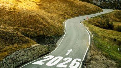 A road with 2026 and an arrow pointing down the road to illustrate looking toward the future and the forecast for 2026.