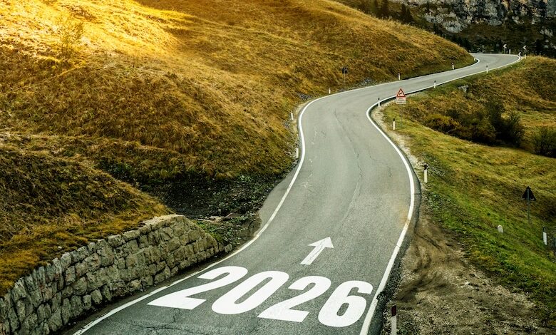 A road with 2026 and an arrow pointing down the road to illustrate looking toward the future and the forecast for 2026.