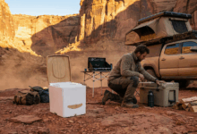 CompoCloset’s urine-diverting dry flush sealing toilet sitting next to a truck camper to illustrate RV fresh water and sanitation products and technologies.