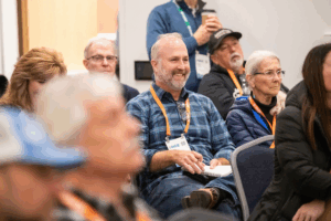 OHCE 2025 Attendee Erik Brown of Seal Rocks RV Cove Takes Note During a Breakout Session
