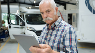 lightspeed senior man looking at tablet in motorhome garageUntitled