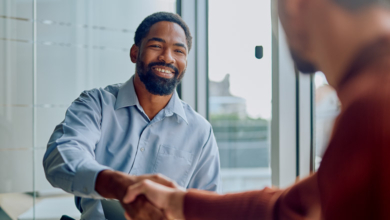 Businessmen shaking hands, illustrating building customer connections and making RV sales.