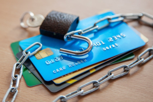 The Buyer Who Never Existed: Synthetic Fraud in RV Sales 3 Credit cards with an open lock and chain