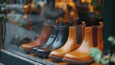 A row of stylish leather boots on display in a store window to illustrate the idea of merchandising to upscale customers.