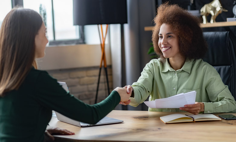 Recruitment manager shaking hands, hiring for job new employee sitting in office.