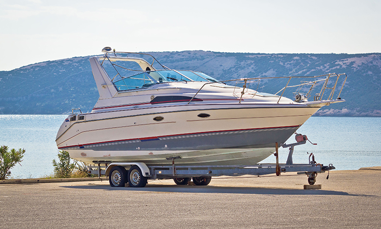 Boat on a trailer by the ocean, illustration what RV dealers can learn from the marine industry.